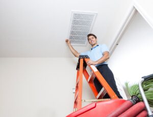 man checking vent to improve airflow